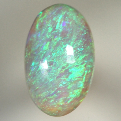 SOLID CRYSTAL OPAL Bright green fire in a 3 dimensional pattern